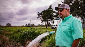 Christian Richard stands next to a groundwater well on his southwestern Louisiana farm. A centuries-old law allows landowners in the state to use as much water as they want for free.