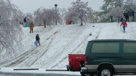 People sledding during the 2009 ice storm, making the best of a bad situation