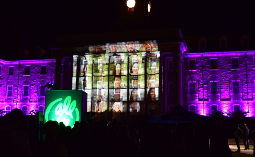 A video presentation launching the "All In at Penn State" program plays on the Old Main facade on Penn State's University Park campus on October 6, 2016. 