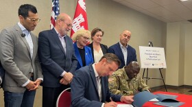 Santa Cruz County Supervisor Zach Friend, Chairman of the Pajaro Regional Flood Management Agency, and Major Shantel Glass, San Francisco District Deputy Commander for the U.S. Army Corps of Engineers, sign a Project Partnership Agreement for the Pajaro River levee reconstruction project. Looking on are (l-r) Assembly Speaker Rob Rivas, D-Salinas; California Sen. John Laird, D-Santa Cruz; U.S. Representative Zoe Lofgren, California Water Resources Director Karla Nemeth, and U.S. Representative Jimmy Panetta.