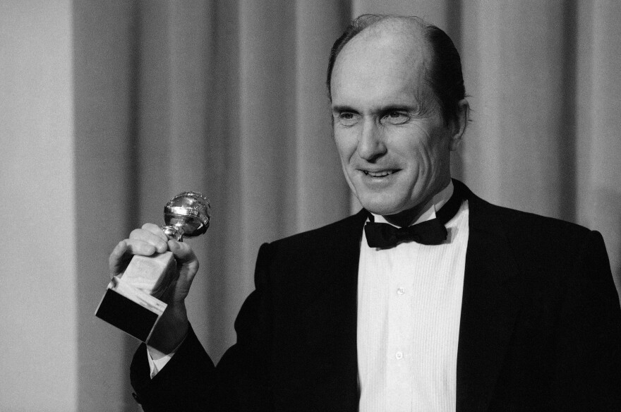 Actor Robert Duvall holds the Golden Globe award he won in Beverly Hills, Calif. January 29,1984 for best actor in a dramatic motion picture, "Tender Mercies." (AP Photo/Lennox Mclendon)