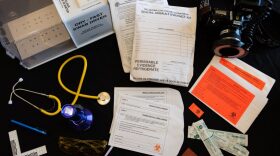 Materials from a sexual assault nurse examiner kit are spread out on a table at the YWCA in Oklahoma City. Swabs, photos, measurements and victim accounts of an incident are all part of the evidence collected by the specially trained nurses.