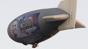 A blimp with a message in support of Republican presidential nominee Mitt Romney flies over Plantation, Fla., on Sunday.