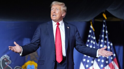 President Donald Trump gestures to the crowd as he arrives to speak at a campaign rally, July 31, 2024.