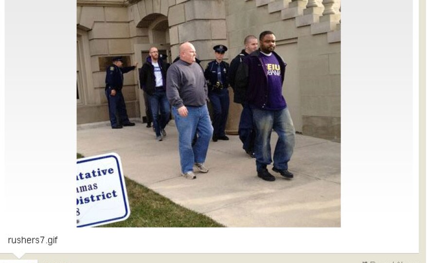 Protestors being led from the Capitol after rushing the Senate floor.