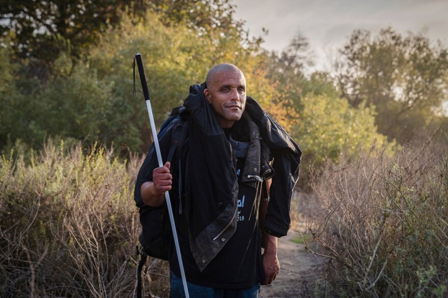 William Brown, 42 , in the woods in San Clemente on Nov. 6, 2021. Brown said he lost $1,000 worth of belongings while being removed from an encampment on Caltrans property and was left with only a backpack and bag.