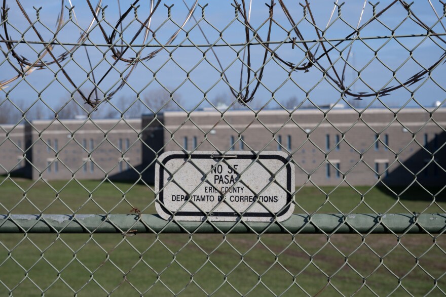 A sign on the fence surrounding Erie County's jail.