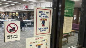 A sign posted on the door of the library at Wichita South High School advises students not to use their phones. In the spring, Kansas lawmakers banned student cell phone use at K-12 schools in the state. 