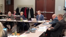 State board members debate the final proposal for new virtual charter school regulations at their December meeting.