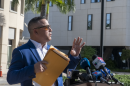 Eleazar Guevara, a nine-year Doral resident, holds a folder he says contain 160 signatures — collected from community members opposed to the city's ICE agreement — outside Doral Government Center on Wednesday, Oct. 7, 2026.