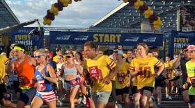 Runners take off at the start line of Pat's Run, a 4.2-mile race honoring former NFL player and Army Ranger Pat Tillman, in Tempe, Ariz., on Saturday, April 11, 2026. (AP Photo/John Marshall)