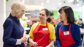 Britain's Camilla, Duchess of Cornwall speaks to members of staff as she attends the opening of the charity and community Kitchen "Nourish Hub," created to fight against social isolation and loneliness, in west London on Thursday.