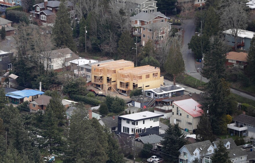 Homes are shown under construction, Friday, Feb. 23, 2018, south of Seattle, Wash. (AP Photo/Ted S. Warren)
