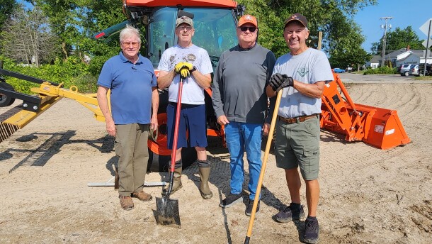 MIShores founder Jeff Welch (left) stands with Dave Szydlowski, Jeff Johnston and Dennis Werblow (right) during a beach clean up at Blair Street Pier in Alpena, Michigan on Friday, July 24, 2026.