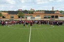 LHS students prepare for drone shots of the student body, gathered to welcome Algerian soccer players to the city.