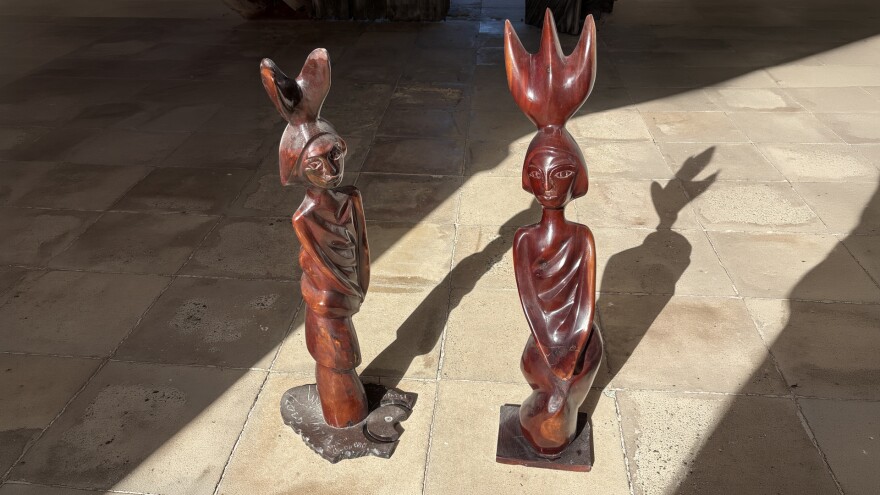 Pictured: Two of the three handcrafted mahogany Fire Burn Queen statues commissioned for Fort Frederik in honor of the 150th Anniversary of Emancipation.