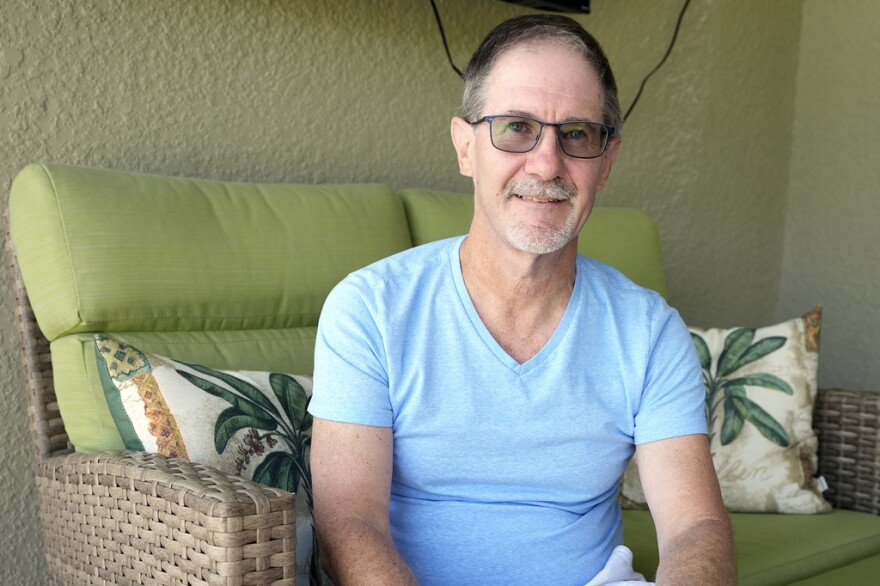 Venice resident Scott Berkheiser, 57, who has Alzheimer's disease, sits for a portrait at his home Friday, April 5, 2024.