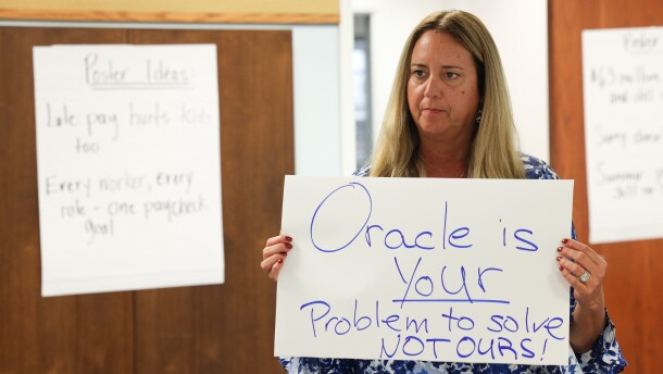 Maria Gonzalez, a school phycologist with RCSD for 26 years, gathered with other union members to make posters to protest the RCSD contract with Oracle that has crated a payroll crisis for hundreds of teachers and support staff who are yet to be paid, paid correctly, paid on time, or have correct payroll deductions made. Union members gathered a the Rochester Teachers Association union offices to make the signs ahead of Thursdays action Infront of districts offices to protect the payroll isssues.