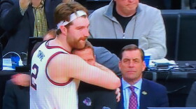 Gonzaga's Drew Timme hugs his coach, Mark Few, as he left late in the game during the Bulldogs' loss to Connecticut in the NCAA Western Regional final.