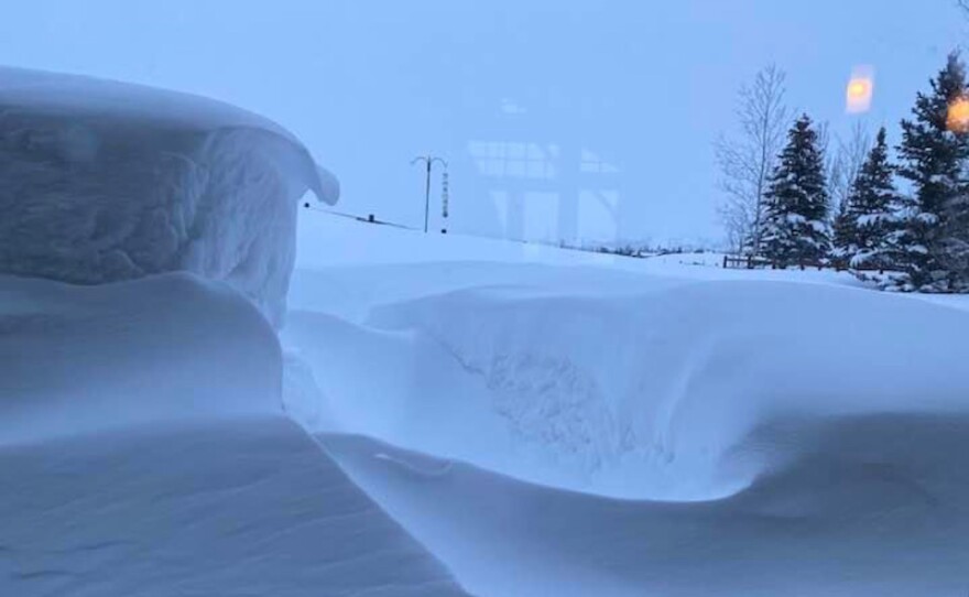 Snow covers the door of a home in Trailside.