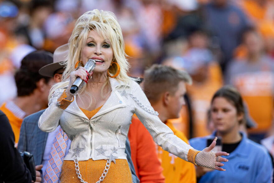Dolly Parton performs during the first half of an NCAA college football game between Tennessee and Georgia Nov. 18, 2023, in Knoxville, Tennessee. (Wade Payne/AP)