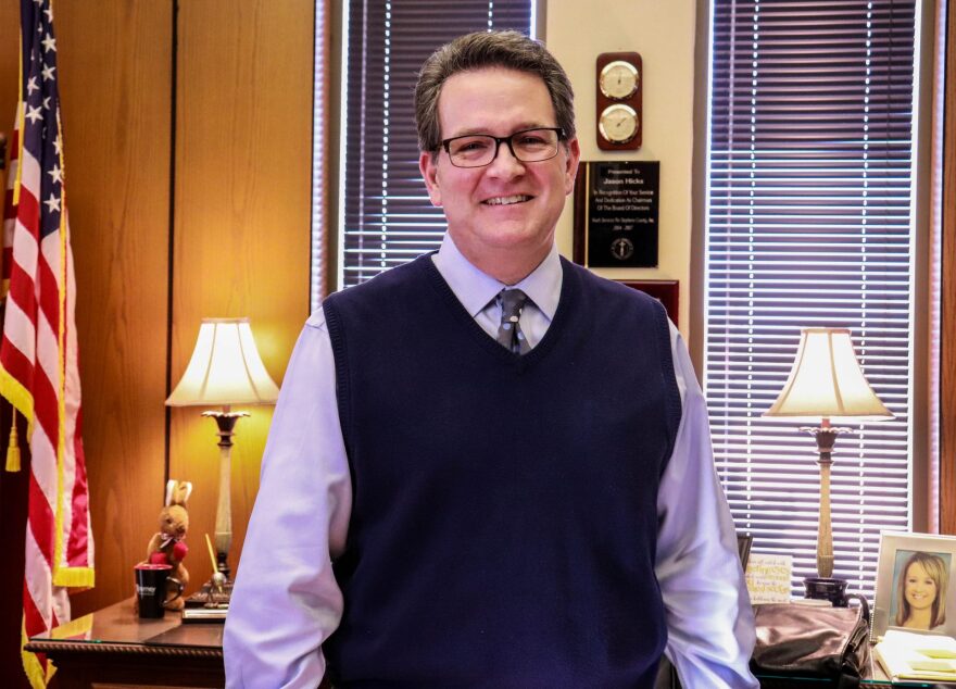 District Attorney Jason Hicks keeps mementos from past cases on a dresser in his office.