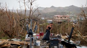 A resident of Puerto Rico cleans up just after Hurricane Maria struck the island on Set. 20, 2017