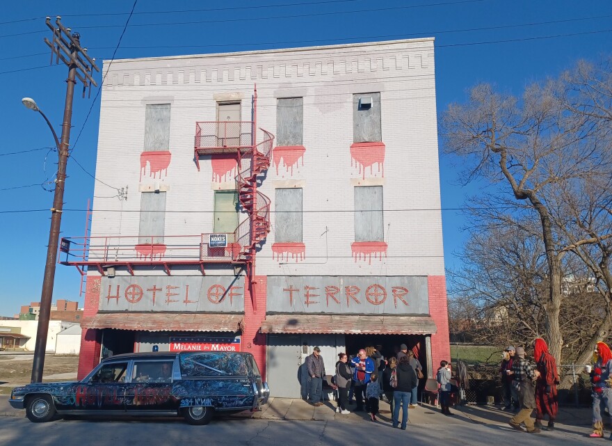 Supporters of letting the Hotel of Terror remain where it is gather in front of the business