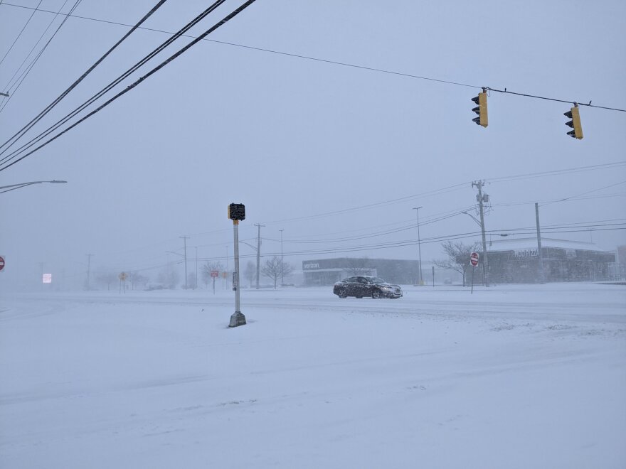 Route 13 in Dover is snow covered and seeing little traffic