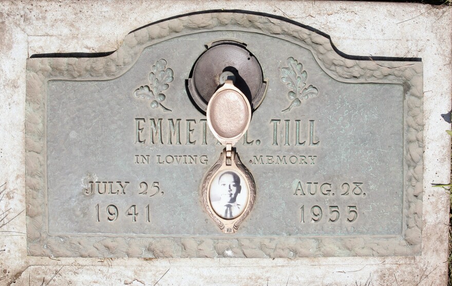 A plaque marks the gravesite of Emmett Till at Burr Oak Cemetery in Alsip, Ill. The 14-year-old was killed in Mississippi in 1955. The FBI has reopened the investigation into his lynching.