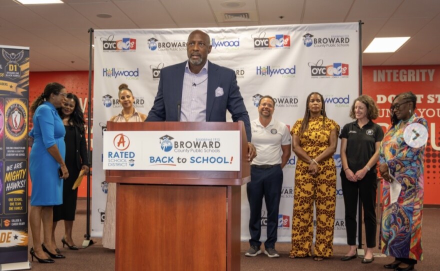 Alonzo Mourning, founder of the Overtown Youth Center, addresses the crowd at the news conference