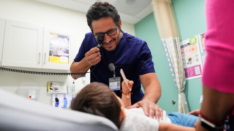FILE - Pediatrician Irving Phillips examines a 16-month-old boy at a CommuniCARE+OLE clinic, June 26, 2025, in Davis, Calif. (AP Photo/Godofredo A. Vásquez, File)
