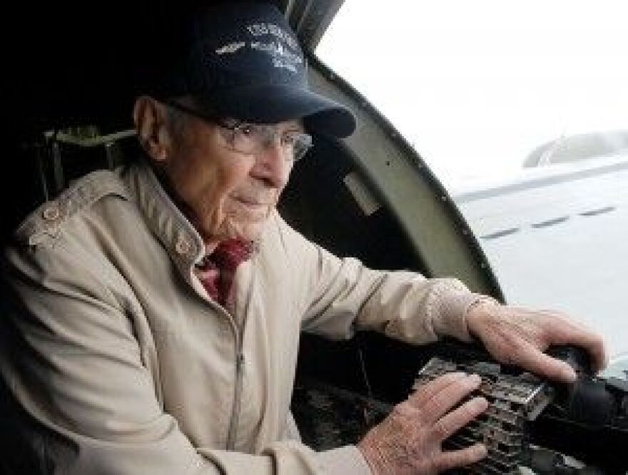 Richard Calland of Maysville observes from a machine gun port Friday while flying on the Aluminum Overcast B-17 Flying Fortress. Calland is a United States Navy veteran and enjoys vintage military aircraft.