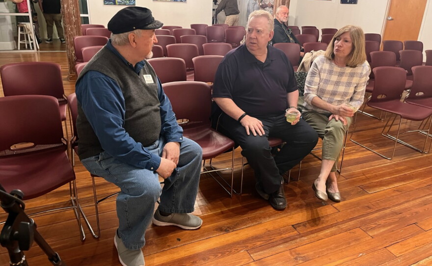 George Scheibner talks with guests