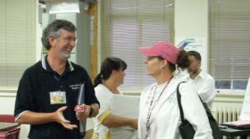 Kevin Strawn talks with another CMS teacher after recent Value Added Work Group meeting.