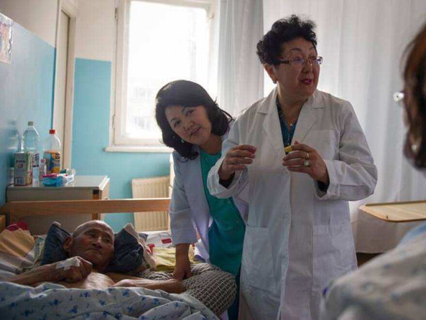 Dr. Odontuya Davaasuren, right, says that a good death is "being comfortable, being with loved people, listening to good words. Even an unconscious person listens, because hearing stops last."