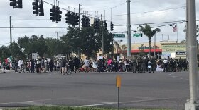 The intersection of U.S. 301 and Big Bend Road was shut down in Riverview after a gathering of about 600 at the Bank of America on 13180 U.S. 301 N spilled onto the roadway.