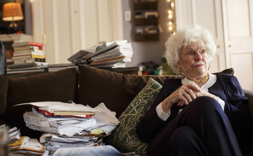 Doris Buffett, the late sister of Warren Buffett, sits with some of the letters Buffett received asking for help, and which inspired a foundation, in Boston on Aug. 2, 2016. The Letters Foundation, as it's known, applied for PPP funding and received nearly $270,000.