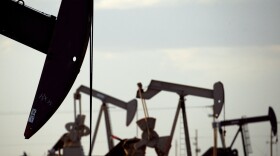 FILE - Pumpjacks work in a field near Lovington, N.M., on April 24, 2015. (AP Photo/Charlie Riedel, File)