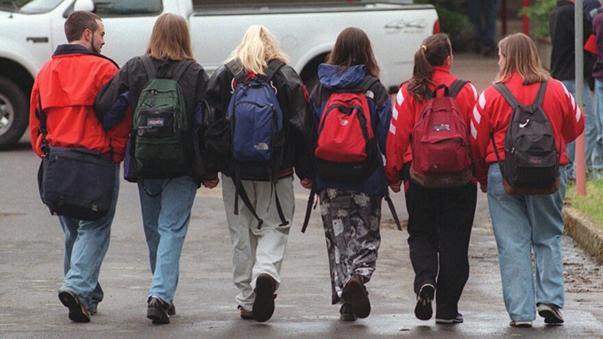 Students walk hand-in-hand to Thurston High School in Springfield, Ore. on May 26, 1998, the first day of classes after the May 21 shooting.