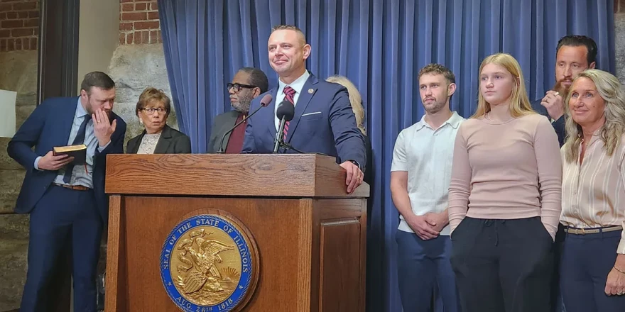 Illinois State Sen. Neil Anderson, accompanied by pastors and family at the Illinois Capitol on Tuesday, Feb. 17, speaks about his bill to outlaw abortion by legally defining fertilized human eggs as “people” and triggering homicide laws.