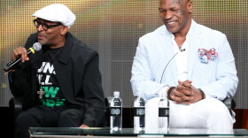 Director Spike Lee and Mike Tyson speak onstage at a panel in Beverly Hills on Thursday.