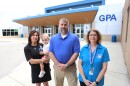 From left, Glasgow Preschool Academy Principal Yvonne Wilkinson holds her daughter, Leighton, alongside district Superintendent Chad Muhlenkamp and Director of Special Education Belinda West. Teachers and administrators will welcome all district 4-year-olds, not just those who qualify, into Glasgow Preschool Academy this fall through Governor Andy Beshear's universal Pre-K pilot program.