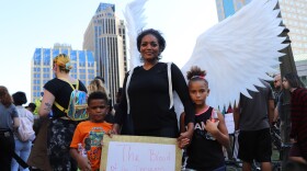 A mother and her children protest in downtown Columbus. 