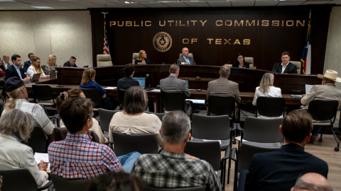 Commissioners of the Public Utility Commission of Texas listen to public comment during a special open meeting in Austin on Friday, August 14, 2026.