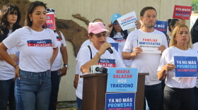 Martha Cabrera (speaker at podium), a longtime resident of the district and a former registered Republican voter, said she changed her voter registration to Non-Party Affiliated after feeling deceived by U.S. Rep. Maria Elvira Salazar’s promises. She spoke at a rally on Thursday, October 29, 2026, in Little Havana.