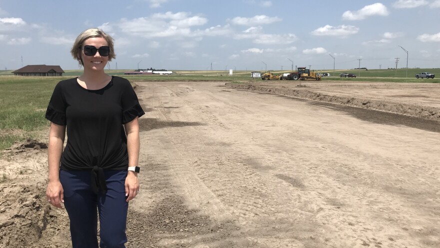 Mary Wilson, director of the local economic development office in Ogallala, Neb., visits the site of a new subdivision on the prairie north of town.