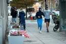 Flowers and an American flag, placed at the scene a day after two National Guard soldiers were shot near the White House in Washington, Thursday, Nov. 27, 2025. (Cliff Owen/AP)