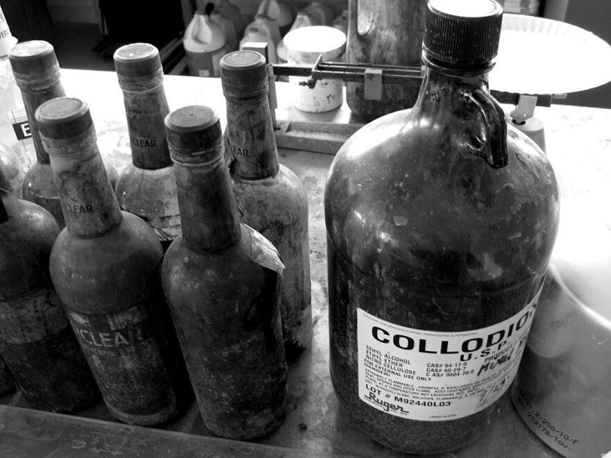 Sally photographed Larry using a cumbersome process that goes back to the 1850s — collodion wet plate, which creates a large-format negative image on glass, not film. These are some of the chemicals used in the process.