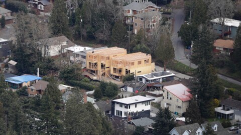 Homes are shown under construction, Friday, Feb. 23, 2018, south of Seattle, Wash. (AP Photo/Ted S. Warren)